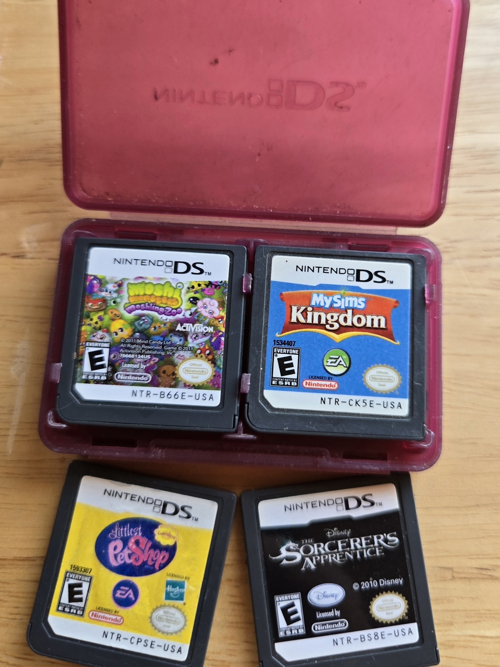 Nintendo DS Pink Cartridge Case with Four Nintendo DS Game Cards